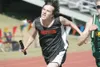ROBERT DeBERRY/Frontiersman Houston freshman Travis Patterson
stretches for the finish line during the boys sprint medley at
Saturday’s Palmer Relays.