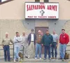 The eight-man team from Tustin Ranch Salvation Army takes a
break outside the Palmer building. Pictured are Dick Davenport, Don
Scroggin, Jim Olson, Ace Wright, Bill Harwell, Kerry Saxon, Jas