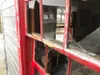 Unknown vandals had desecrated the premises, leaving smashed windows, emptied fire extinguishers, and a barred doorway sealed with wooden board kicked in with black shoe marks left above the 
