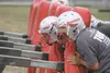 Members of the Wasilla High football squad hit the blocking sled during a team practice Wednesday. Wasilla opens the 2013 season Aug. 17 against West Anchorage. JEREMIAH BARTZ/Frontiersman