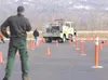 ROBERT DeBERRY/Frontiersman Palmer resident Cal Maki watches as
a member of a Division of Forestry engine crew maneuvers a fire
truck through a course of pylons Thursday during the agency’s
f