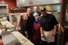 Alaska’s Best Phillys owner Rodanthe Christou (who goes by Laura) poses for a pictures with her crew in the kitchen. Jacob Mann/Frontiersman