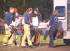ROBERT DeBERRY/Frontiersman Wasilla senior Adrese LaVern is
loaded into an ambulance after suffering a broken upper arm during
the Warriors’ loss to Colony at Wasilla High School on Friday.