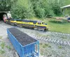 ROBERT DeBERRY/Frontiersman Alaska Live Steamers engineer Steve
Carrington moves this Alaska Railroad 1/8-scale train out of a
tunnel and past a coal car at the end of a 1.6-mile ride that wi