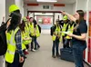 Talon Boeve, right, gives students instructions for the scenario-based exercise for My PI, which wrapped up this week