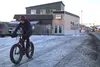 Drew Hosselton rides his fat tire bike away from Backcountry Bike and Ski. Tim Rockey/Frontiersman