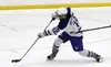 Palmer freshman Jaron Ketterman takes the blade of a diamond stick to the side as he releases a shot during a loss to the Lynx earlier this season. Courtesy of Bruce Eggleston/matsusports.net