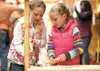 Winter Meier, 8, and her sister Lily, 5, build a lemonade stand at The Home Depot store in Wasilla for last year’s Lemonade Day. Frontiersman file photo