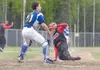 ROBERT DeBERRY/Frontiersman Houston senior Zack Qual slides into
home plate during a 27-1 win over Monroe Catholic Friday at Houston
High School. Qual finished 2-for-2 and scored a pair of ru