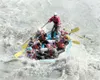 Courtesy photo NOVA A NOVA paddle raft punches through a hole on
the Lion Head section of the Matanuska River.
