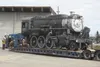 Engine No. 557 sits on a large flatbed trailer after making a slow trip up the Glenn Highway to a Wasilla warehouse, where it will remain as it’s renovated and restored to be put back into se