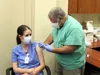 Alaska Chief Medical Officer Dr. Anne Zink was given the COVID-19 vaccine by Dr. Michael Alter Friday at Mat-Su Regional Medical Center.