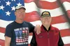 Andy Covlasky and his father, World War II veteran John Covlasky, stand in front of a mural Andy painted on a wall inside American Legion Post 35. Covlasky has been waiting a long time to pai