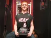 Layton Dunham sits in his room done in the colors of the Miami Heat with his LeBron James jersey and 2013 National Championship hat. Dunham was severely injured when he was struck by a vehicl