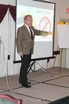 Mike Blinder speaks at Evangelo's Restaurant in Wasilla. (Chris Ford/Frontiersman)