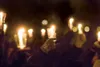 Participants in the Light For Life candlelight vigil hold up
their candles Saturday at Newcomb Park in Wasilla. (ROBERT
DeBERRY/Frontiersman)