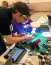 Justice Darby and Liam Pavilionis of Mat-Su College constructing their experiment as part of RockOn 2024, in which teams of 3, including an advisor, construct an experiment that will then be 