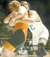 Colony junior Eric Fan tries to throw West Anchorage’s Trevor
McDonald during the 215-pound match of the ASAA 4A state finals in
December. Fan won a state title, and over the weekend the CHS
