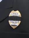 Palmer Police Chief Lance Ketterling's badge is covered with a black band as a show of respect for Palmer Officer James Rowland Jr., who was shot to death on May 15, 1999. Courtesy photo