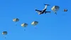 U.S. Army soldiers assigned to 2nd Infantry Brigade Combat Team (Airborne), 11th Airborne Division, descend from the sky onto Malamute Drop Zone on Joint Base Elmendorf-Richardson, Alaska for