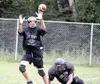 JEREMIAH BARTZ/Frontiersman A Colony receiver snags the ball
during a passing drill at practice Thursday afternoon at Colony
High.