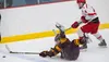 Wasilla's Easton McCree skates toward the puck as a Dimond player falls to the ice during a physical state semifinal game at the Menard Arena. J. David McChesney/Frontiersman