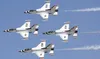 The U.S. Air Force Thunderbirds perform the "Diamond pass and review". (U.S. Air Force photo/Staff Sgt Richard Rose Jr.) Staff Sgt Richard Rose Jr