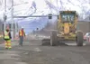 Traffic moves along the Palmer-Wasilla Highway near Trunk Road
at a slow pace as a road grader smooths out the shoulder Monday
afternoon. (ROBERT DeBERRY/Frontiersman)