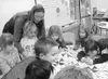 Students at Talkeetna Elementary School prepare a quilt they
donated to the Special Santa program. Submitted photo.