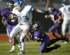 John Wagner/Fairbanks Daily News-Miner Palmer’s Brennan Bohman,
center, works the ball up field despite the efforts of Lathrop’s
Brennan LaButa Saturday evening, August 16, 2008, at Lathrop i