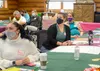 Spouses of Heart Link play a jeopardy game during Heart Link at Joint Base Elmendorf-Richardson, Alaska, Aug. 25, 2021. Heart Link is an orientation program to help new military spouses adjus