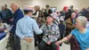 Students from Our Lady of the Valley Catholic School mingle with veterans and their families during a celebration held to honor WWII and Korean War veterans on Sunday, Dec. 6, 2015. Photo cou