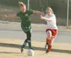 ROBERT DeBERRY/Frontiersman Colony’s Jessica Parker and
Wasilla’s Tabitha Bare battle for the ball during the first half of
Monday’s game at Colony High School.