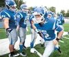 Palmer's Zeth Meritt slaps fives as he takes the field before the start of Palmer's game against the Bartlett Golden Bears. ROBERT DeBERRY/Frontiersman.com
