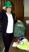 CASEY RESSLER/Frontiersman Linda Schwankl shows a CERT backpack,
which includes safety tools such as a first aid kit, a flashlight
and a reflective vest.