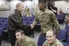 Alaska Gov. Bill walker greets Alaska Air National Guard Senior Airman Aaron Hamilton, an aircrew flight equipment Airman with the 176th Operations Support Squadron, Sept. 25, 2018, at Joint 