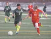 Colony forward Ben Sande races down the field past an East Anchorage defender during a win over the Thunderbirds Friday at Colony High School. Jeremiah Bartz