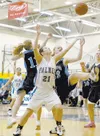 DEREK CLARKSTON/Kodiak Daily Mirror Palmer’s Mikaela Bolling and
Soldotna’s Jenna Jensen (11) and Shelby Dykstra battle for a
rebound during the first round of the Northern Lights Conference
