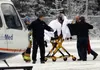 A man is moved to a waiting helicopter after suffering a gunshot wound to the face on Saturday in the Butte. MATT TUNSETH/Frontiersman.com
