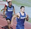 Palmer's Dustin Eley (left) and Cleo Munoz (right) sprint toward
the finish line in the 100-meter dash during the Mat-Su Borough
Championships at Palmer High School on Wednesday.WILLIAM WOODY