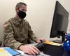 U.S. Air Force Maj. Tim Anderson, the 673d Medical Group Military Health System Genesis program manager, works on integrating MHS Genesis at Joint Base Elmendorf-Richardson, Alaska, Oct. 31, 