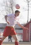 Wasilla sophomore Cash McGregor heads the ball during a scoreless tie against Homer on Thursday at Wasilla High School. JEREMIAH BARTZ/Frontiersman