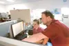 Brenna Poulson and Daniel Seamount discuss a mapping project
Friday at TerrSond's Palmer headquarters. (ROBERT
DeBERRY/Frontiersman)