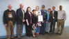 Alaska State Trooper Sgt. Luis Nieves and his wife, Wasilla High School teacher Wrynn Nieves, receive a proclamation from the Mat-Su Council on Aging during its meeting April 30. The couple w