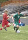ROBERT DeBERRY/Frontiersman file photo James Meaney drives the
ball up the field during a match against Wasilla last season.
Meaney, the all-time leading goal-scorer in Colony boys soccer
his