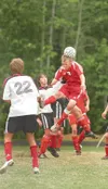 ROBERT DeBERRY/Frontiersman Wasilla Warrior John Pahkala heads
the ball into the goal for the first score of the game against the
Kenai Kardinals during the region championship game Saturday 