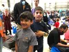 Two young Afghan travelers are excited about their eminent journey to America from Ramstein Air Base, Germany.