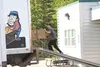 Employee with Valley Moving and Storage pushes a loaded dolly into the back of a moving truck Friday at Mat-Su Services for Children and Adults old site off Shennum Drive along the Palmer-Was