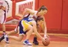 Wasilla senior Kelsey Cottle goes after the ball against Newberg
Tiger Abbie Woginrich during the Warrior's game Wednesday at the
Doc Larsob Roundball Classic at Wasilla High School. (ROBERT
