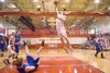 ROBERT DeBERRY/Frontiersman Wasilla junior forward Connor Devine
elevates to the rim for a layup down a wide-open lane against the
Palmer Moose on Friday. The Warriors won a see-saw game on a